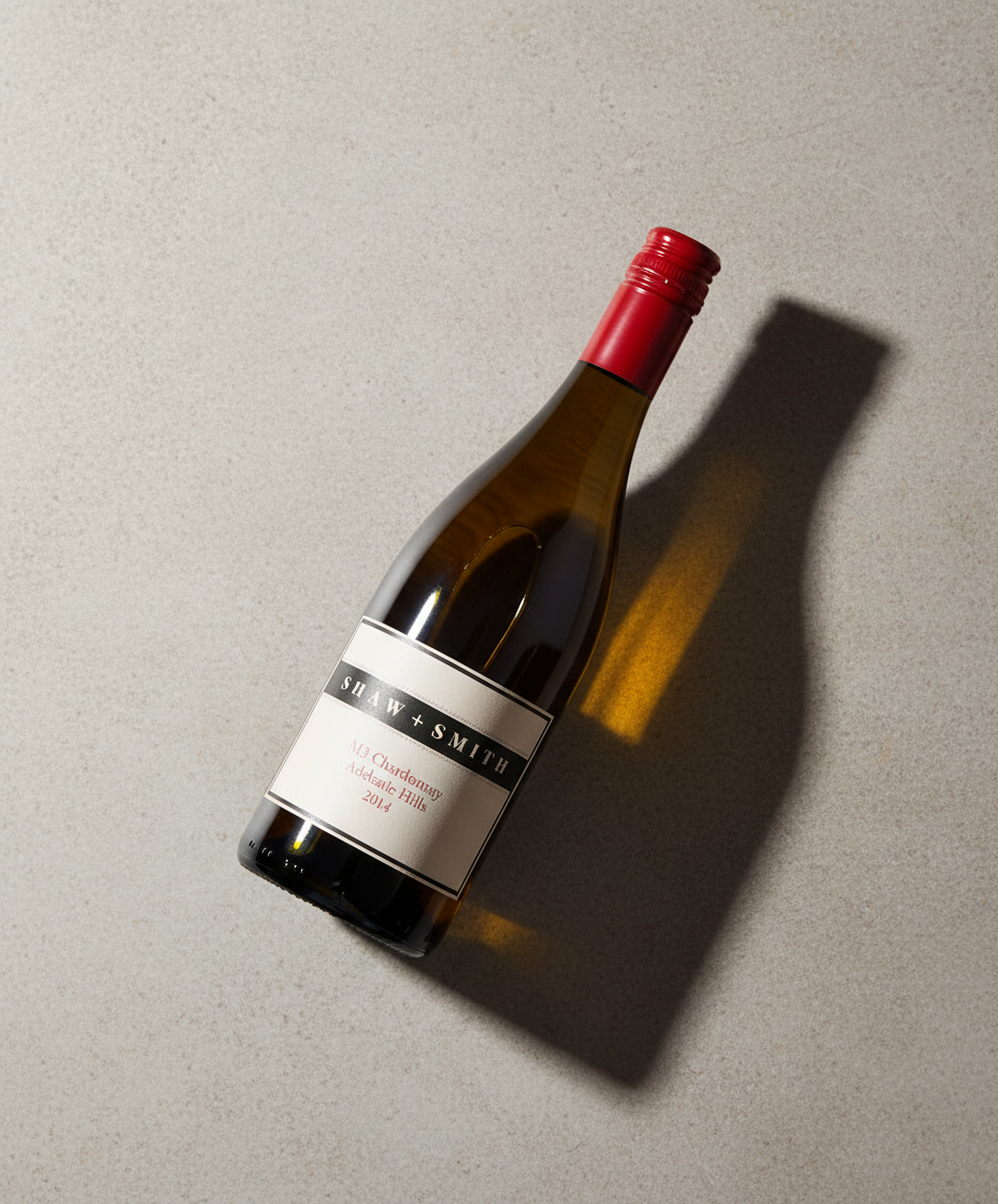 Shaw and Smith M3 Chardonnay 2023 bottle on a light surface with distinct shadow portrait 928x1120