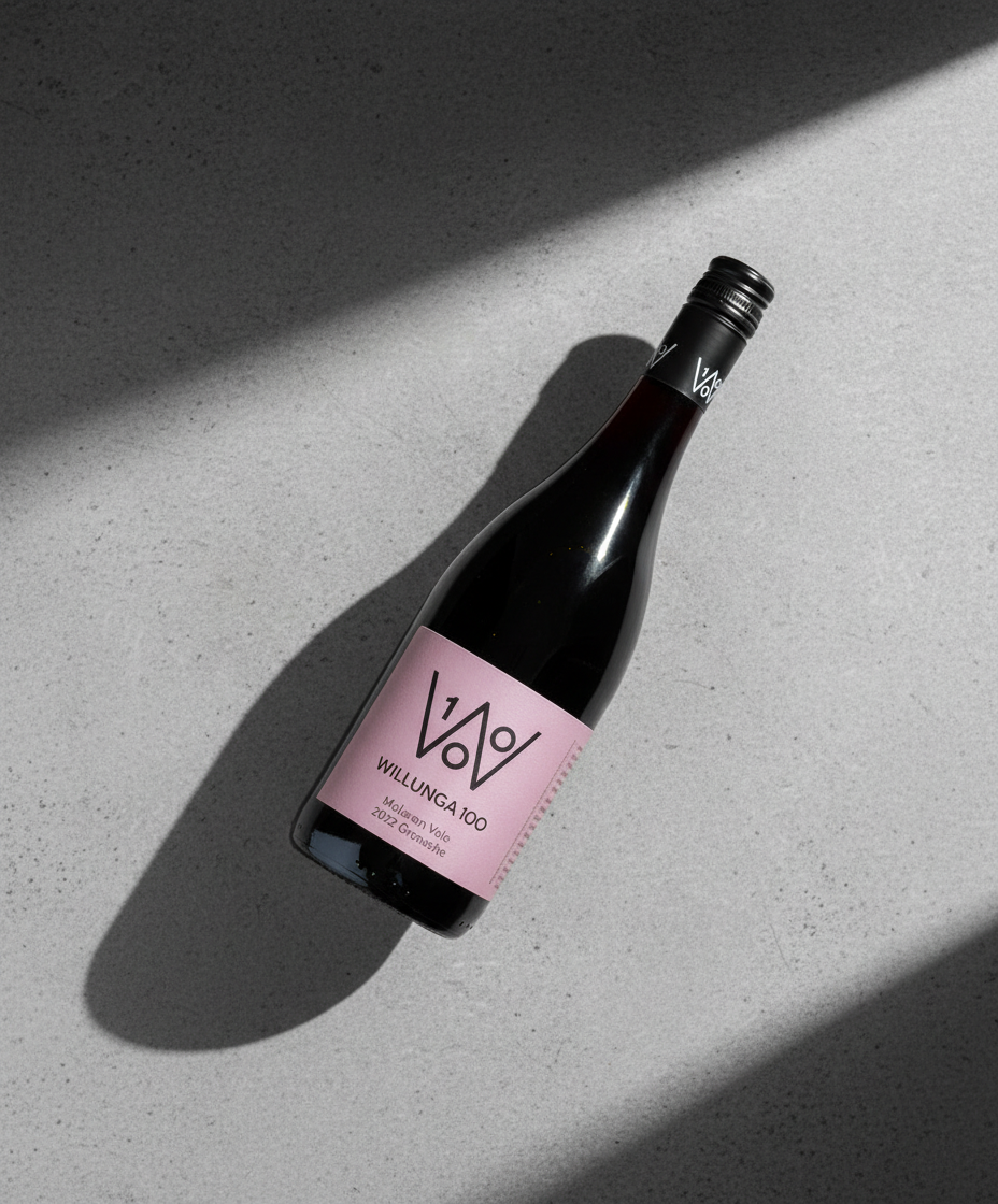 Willunga 100 Grenache 2022 bottle with pink label on grey surface, gallery position 5 portrait view