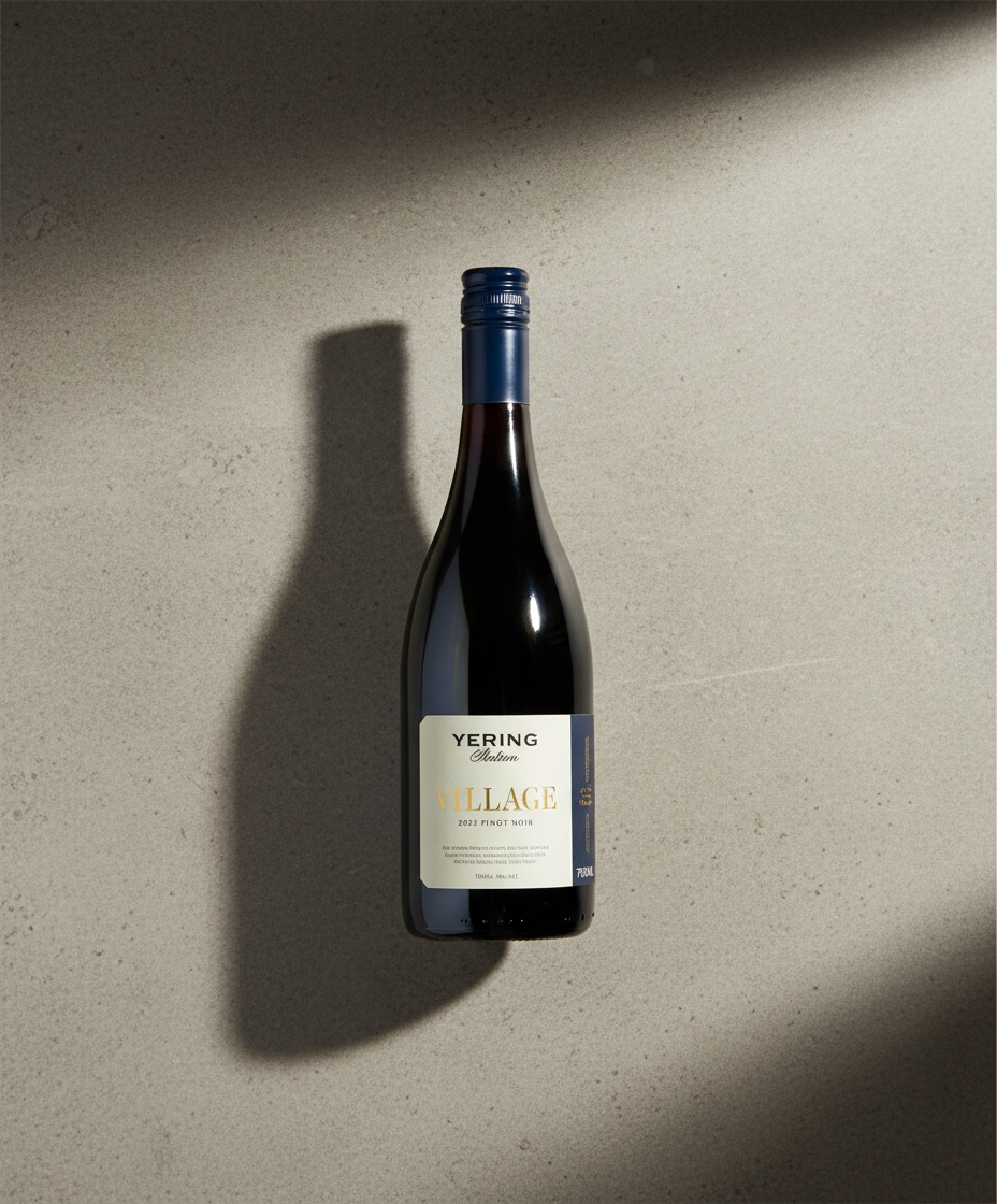 Yering Station Village Pinot Noir 2024 red wine bottle in portrait with shadow on gray background