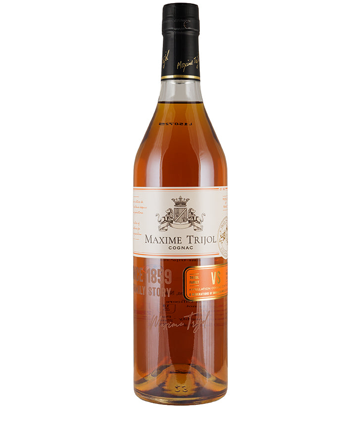 Bottle of Maxime Trijol VS Cognac with amber liquid and detailed white and orange label visible
