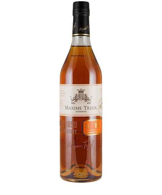 Bottle of Maxime Trijol VS Cognac with amber liquid and detailed white and orange label visible