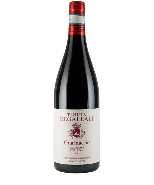 Bottle of Tenuta Regaleali Tasca Guarnaccio Perricone 2022 red wine with label and red foil top.