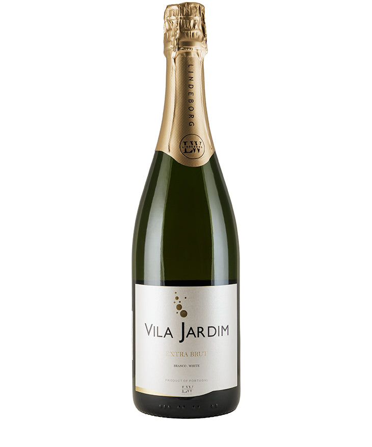 Bottle of Vila Jardim Extra Brut 2021 sparkling wine with gold foil top and white label on green glass bottle.