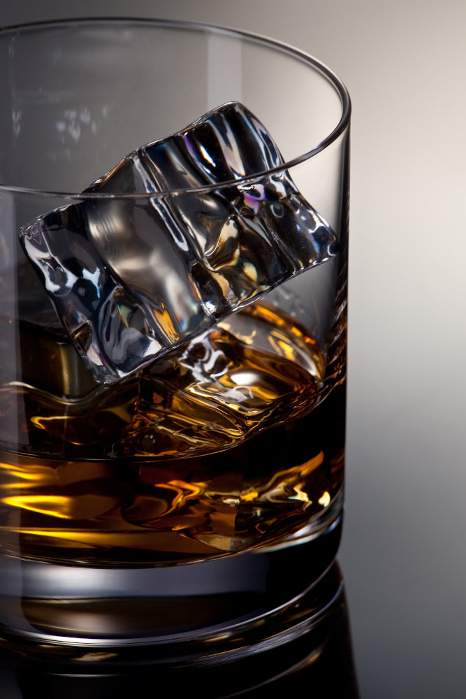 Whisky Glass with Ice and amber coloured whisky